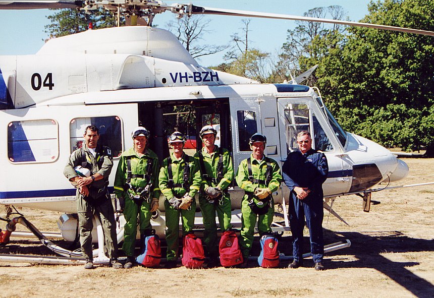 The rappel crew and pilot pose for a group photo after a successful demonstration before the Queen of their skills.
