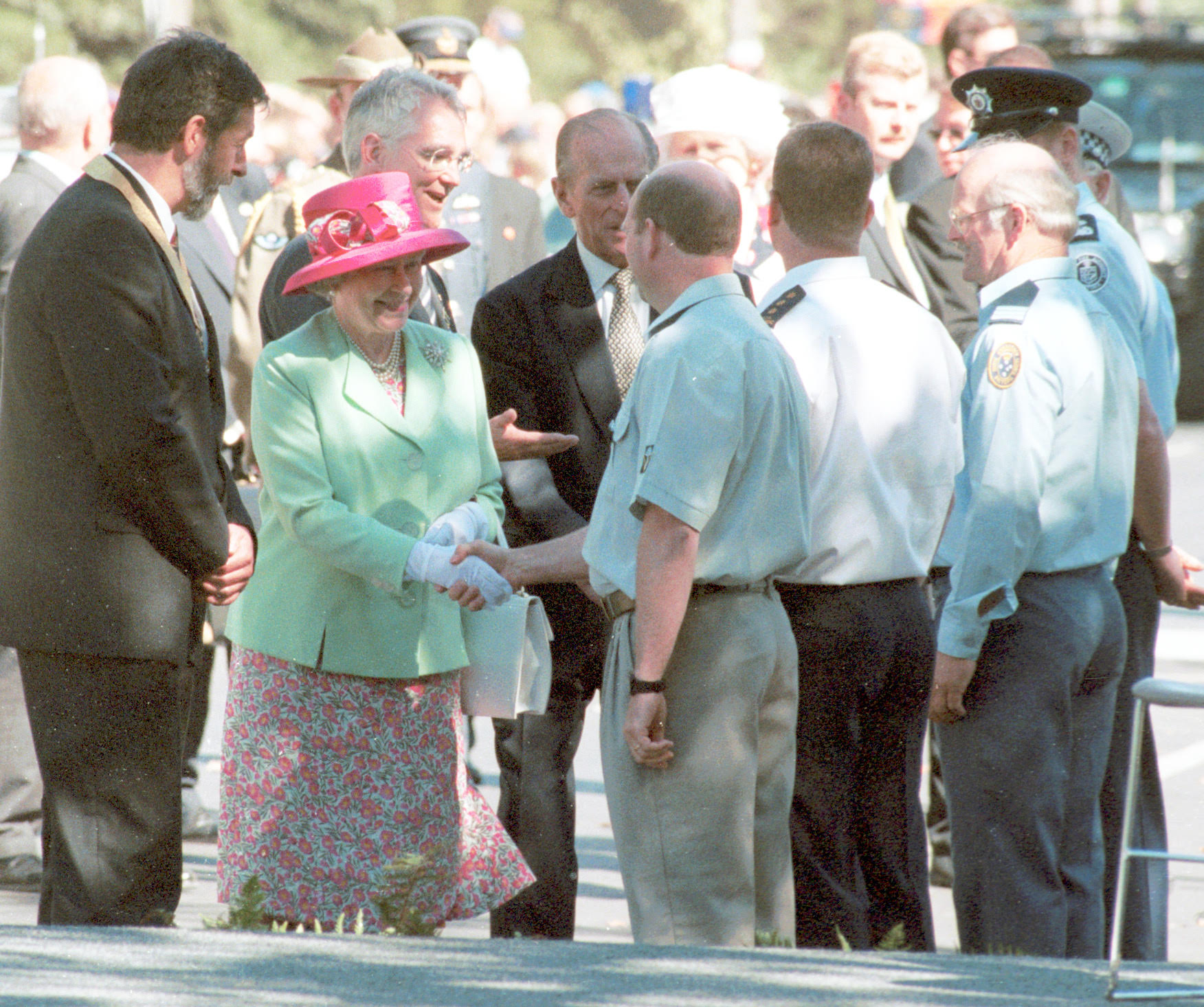 The Queen shakes hands with Jon Sanders